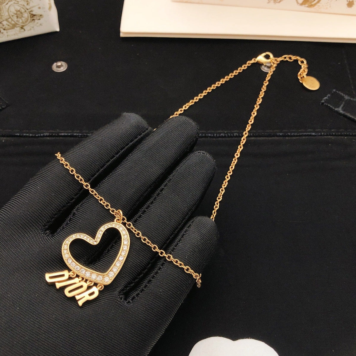 Martin Graham pendant necklace in polished metal-tone – side detail