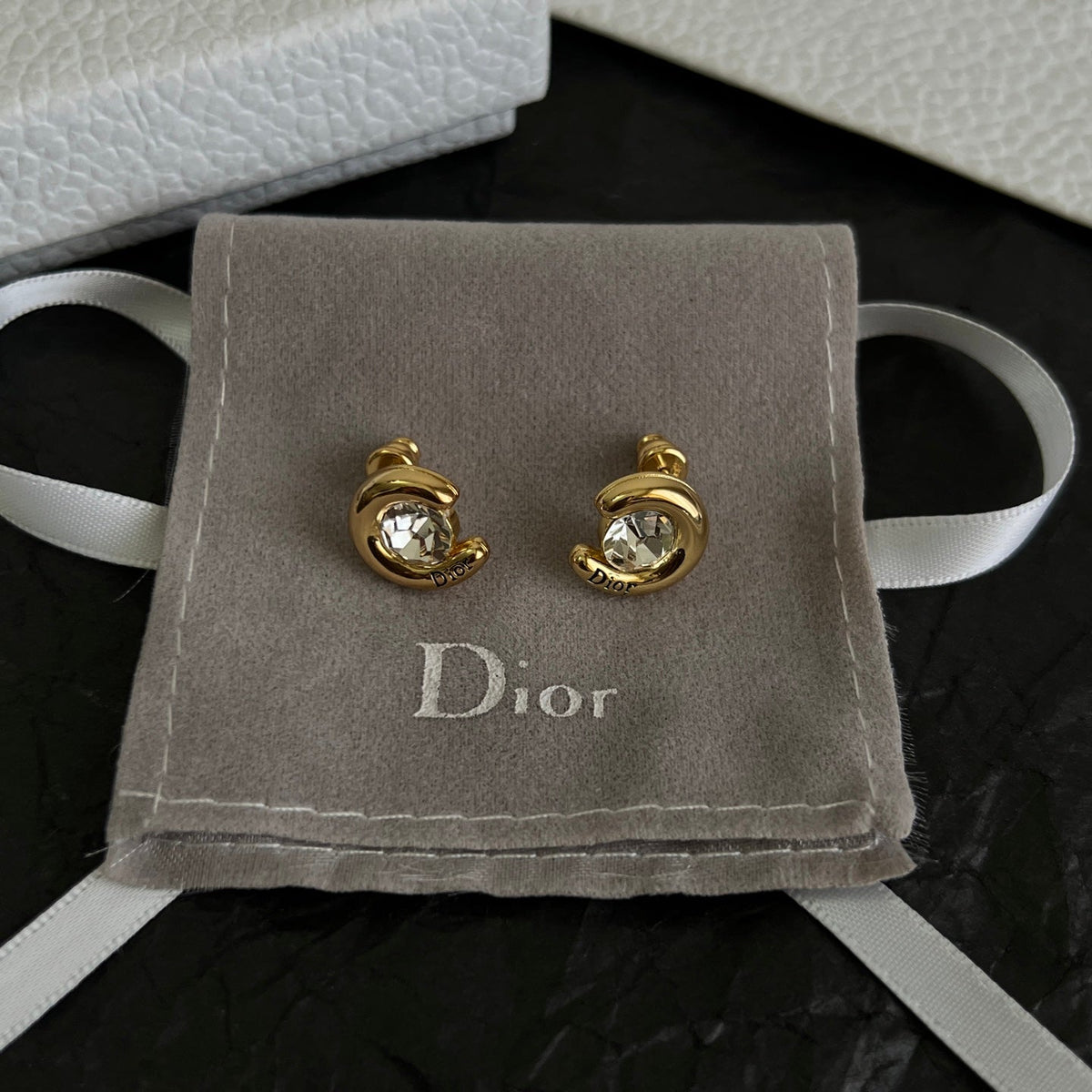 Martin Graham stud earrings in polished metal-tone – side detail