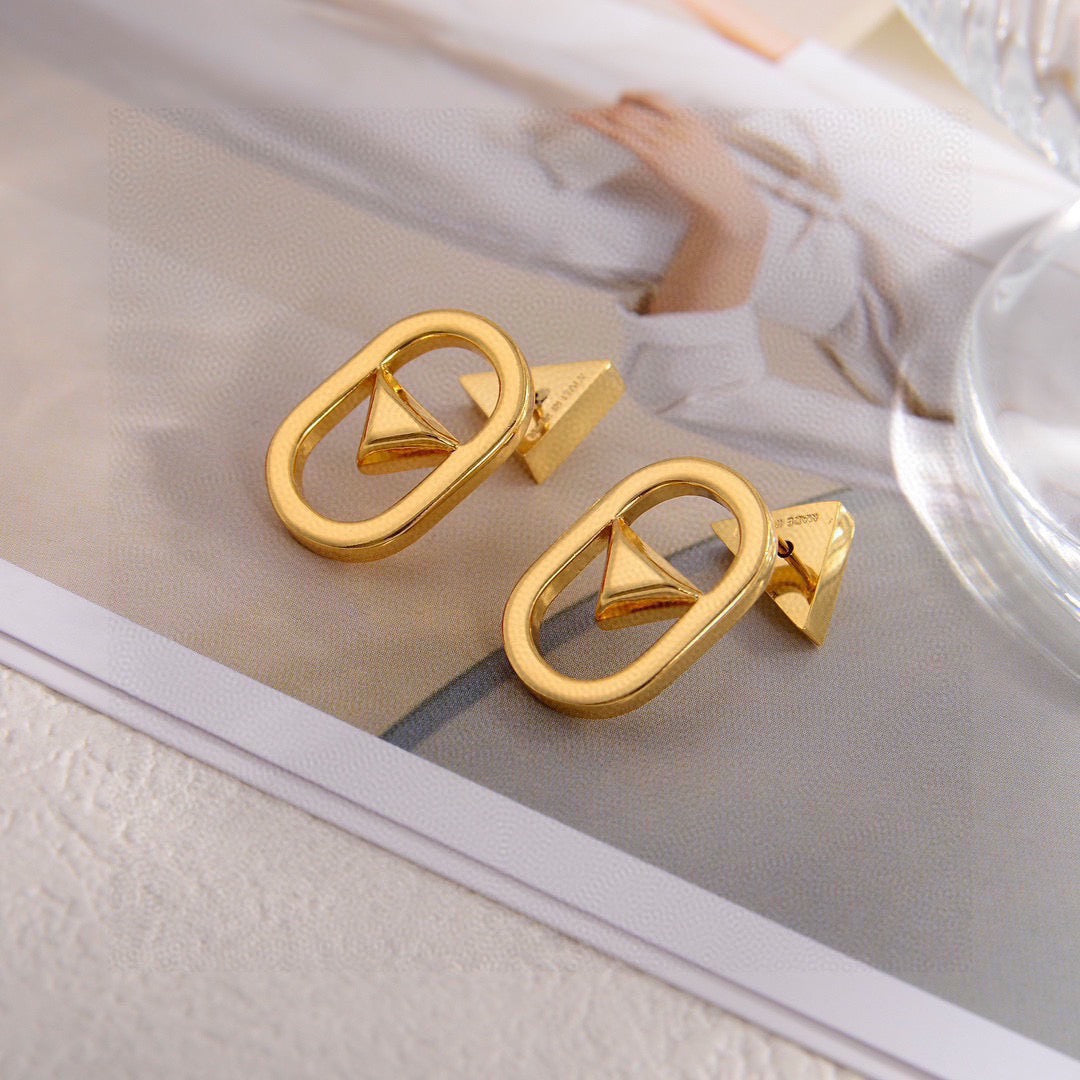 Martin Graham stud earrings in polished metal-tone – side detail