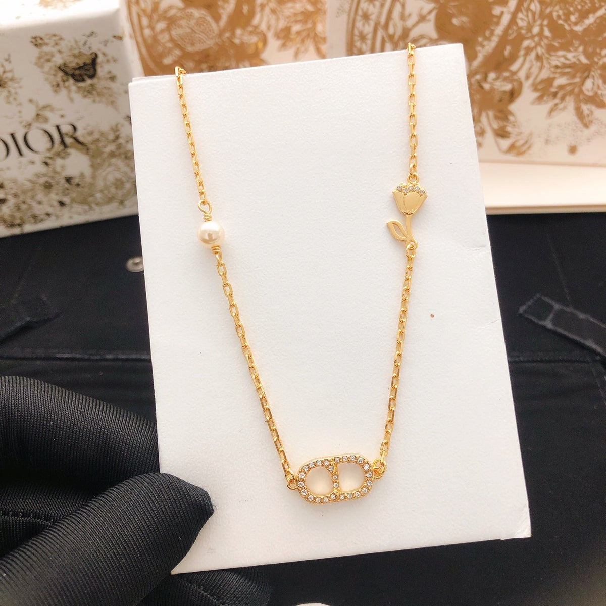 Martin Graham pendant necklace in polished metal-tone – side detail
