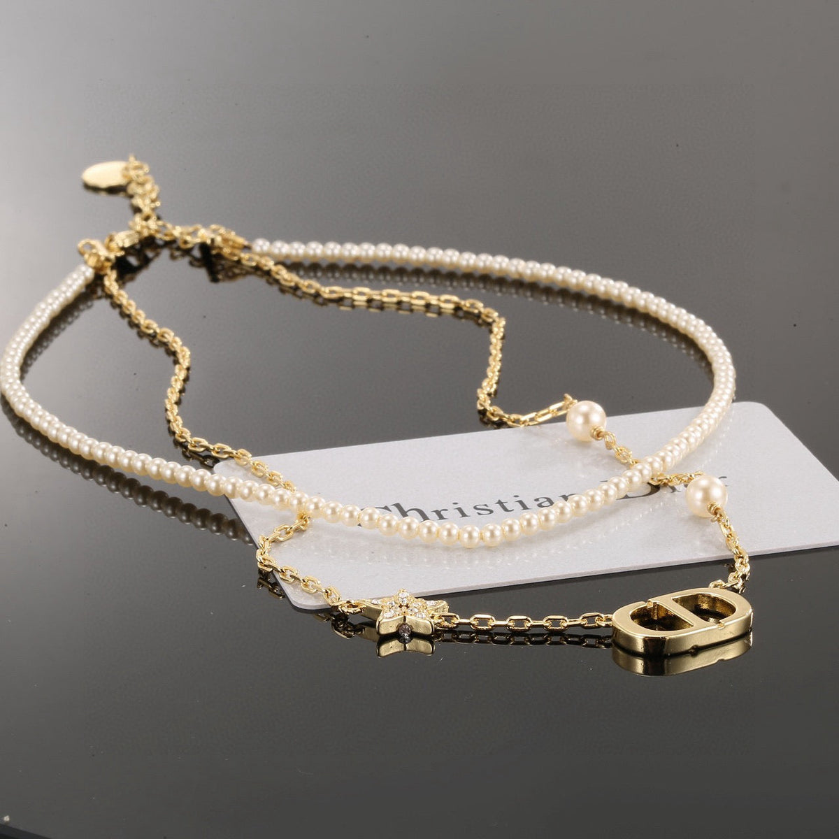 Martin Graham pendant necklace in polished metal-tone – side detail