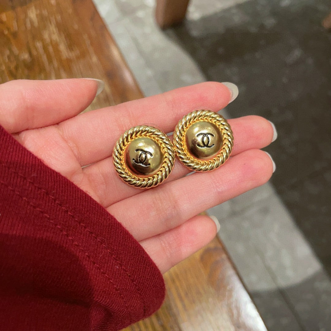 Martin Graham stud earrings in polished metal-tone – side detail