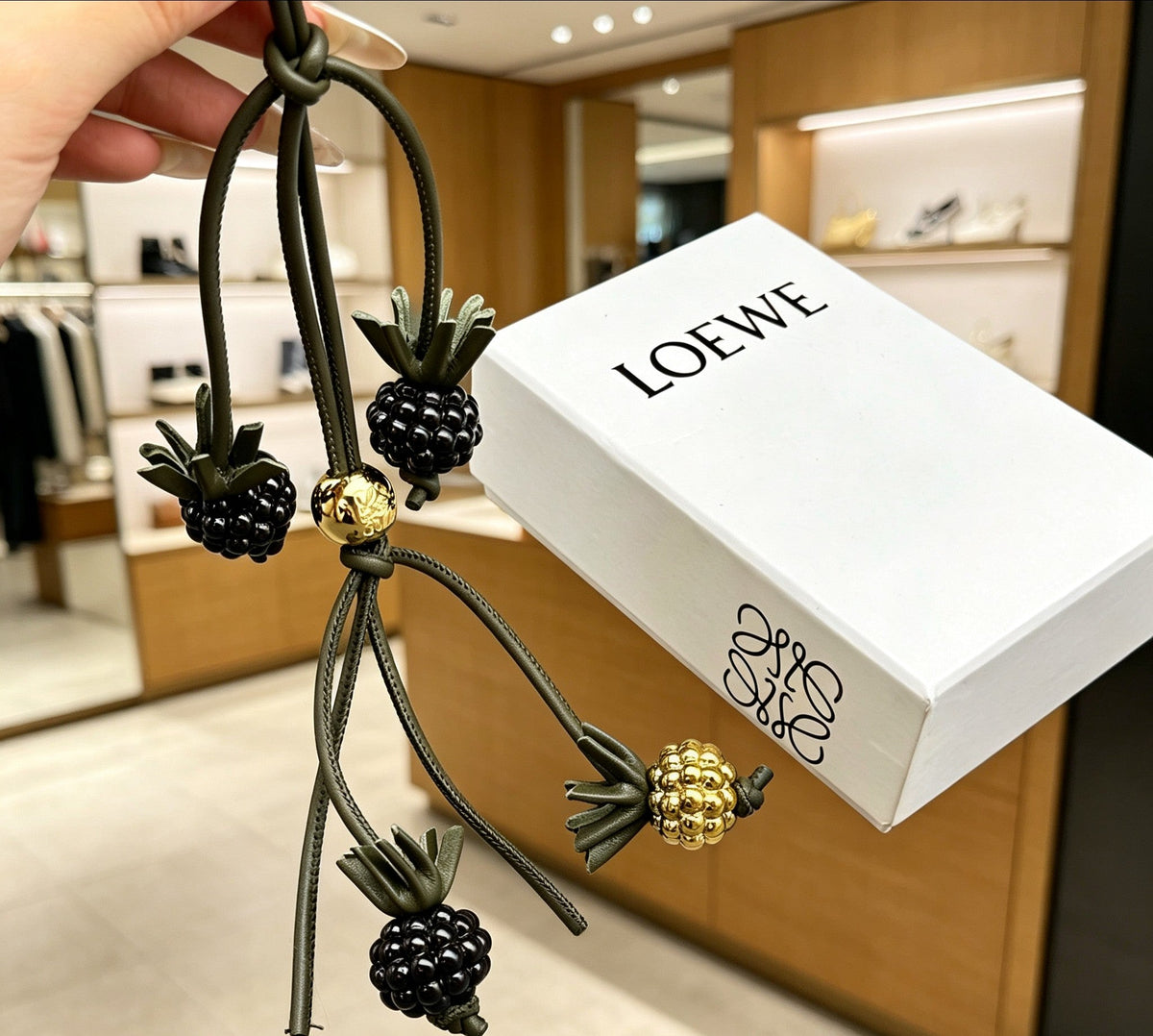 Martin Graham bag charm in polished metal-tone – side detail
