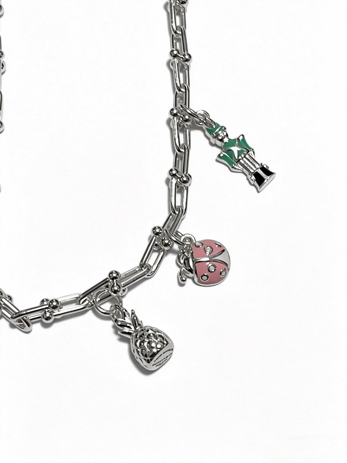 Martin Graham pendant necklace in polished metal-tone – side detail