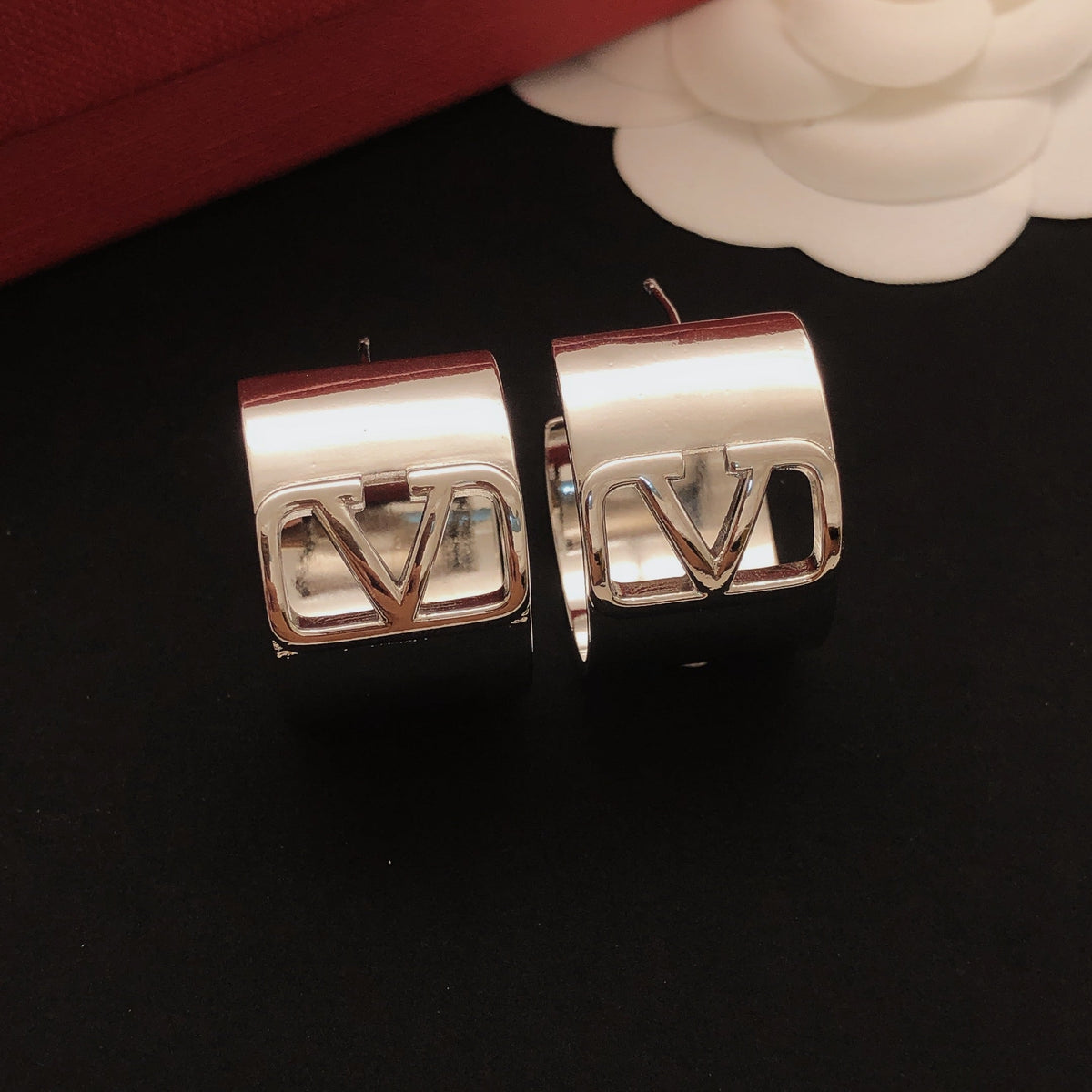 Martin Graham drop earrings in polished metal-tone – side detail