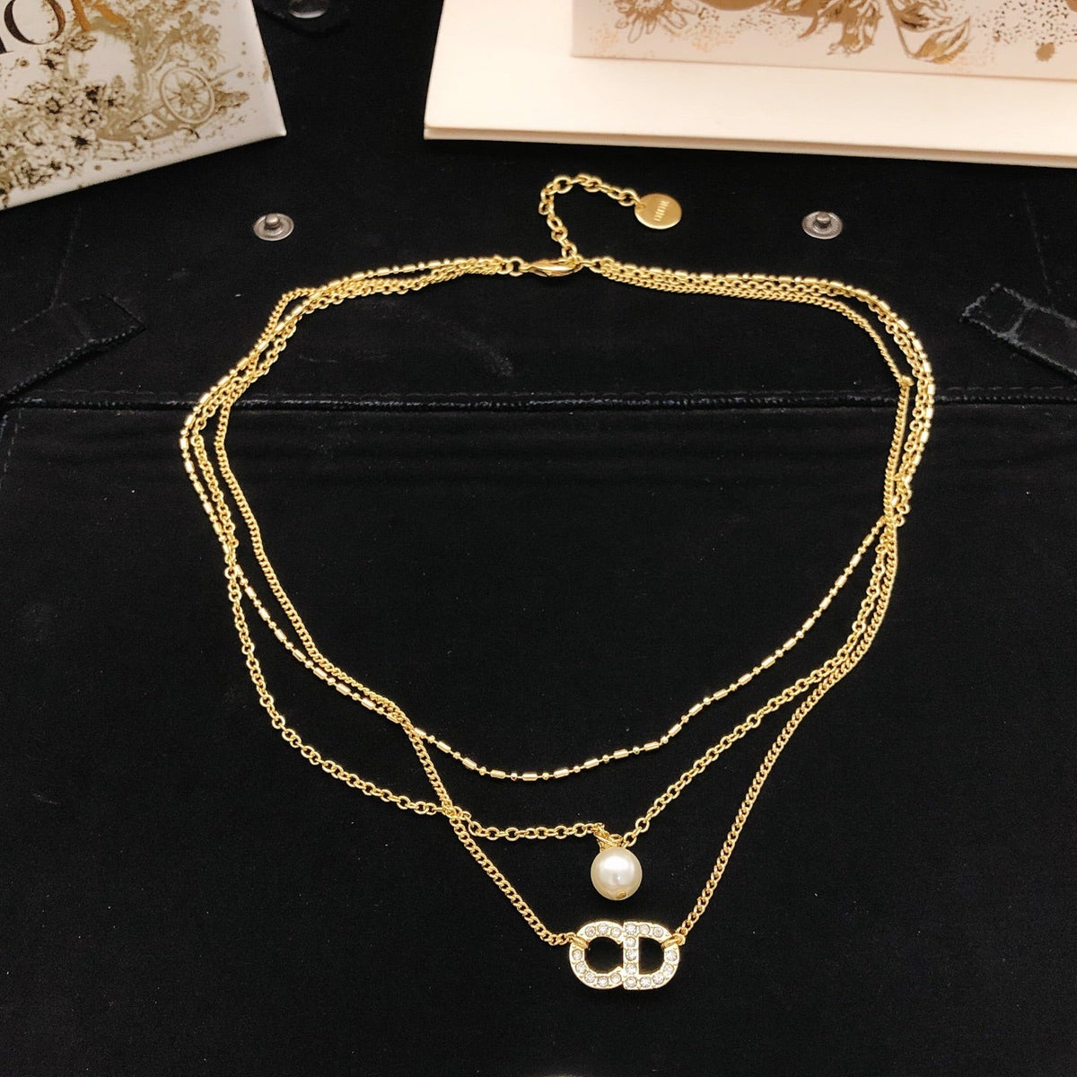 Martin Graham pendant necklace in polished metal-tone – side detail