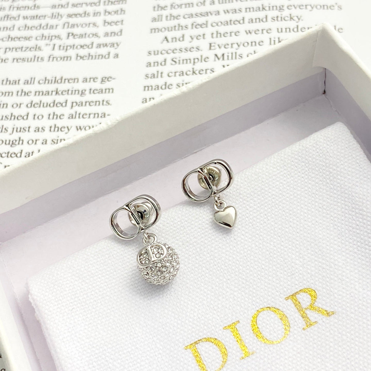 Martin Graham stud earrings in polished metal-tone – side detail