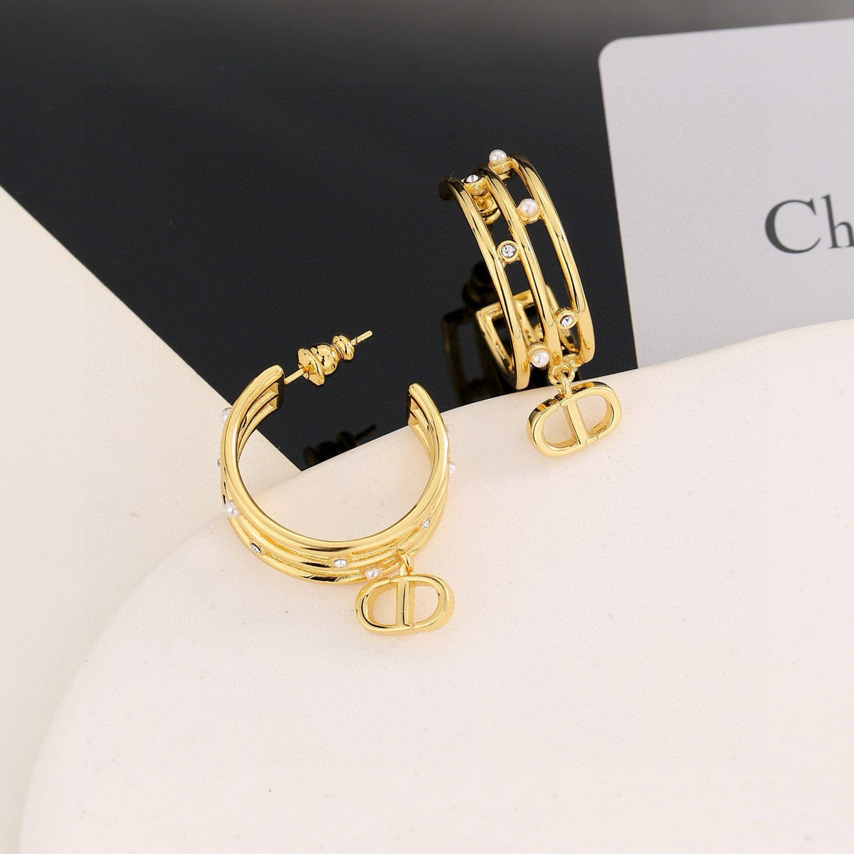 Martin Graham stud earrings in polished metal-tone – side detail