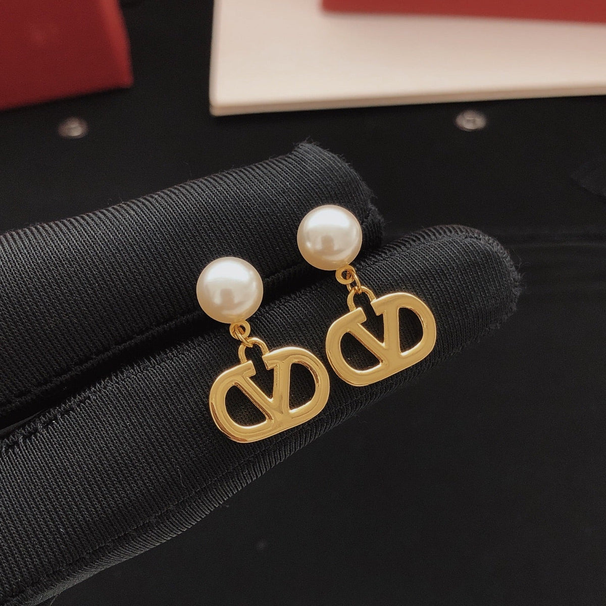 Martin Graham stud earrings in polished metal-tone – side detail