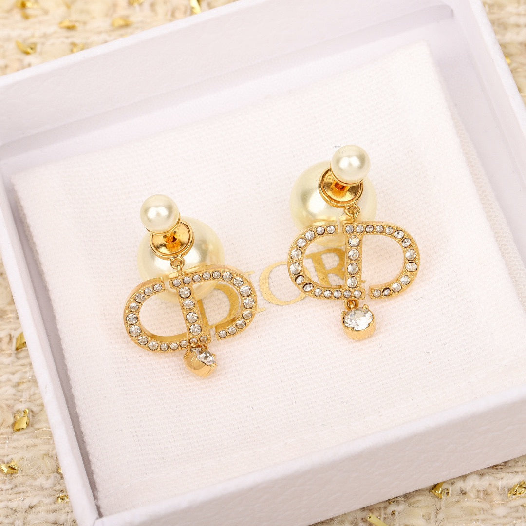 Martin Graham stud earrings in polished metal-tone – side detail