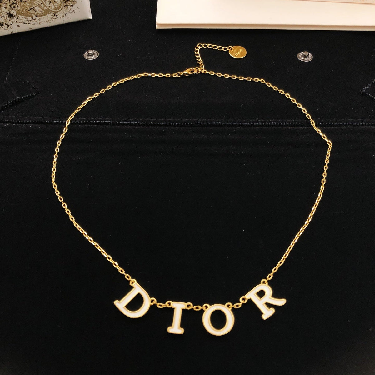 Martin Graham pendant necklace in polished metal-tone – side detail
