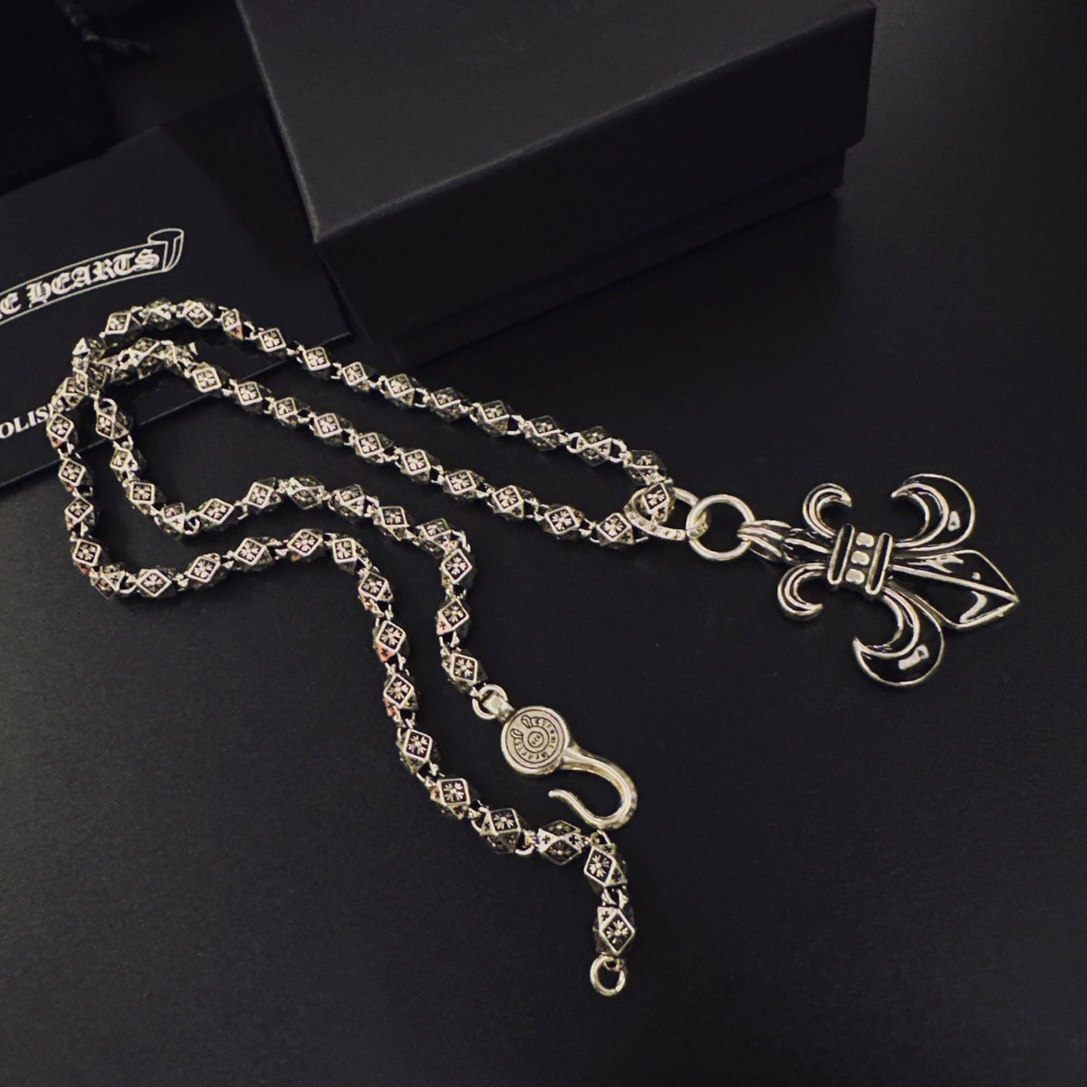 Martin Graham pendant necklace in polished metal-tone – side detail