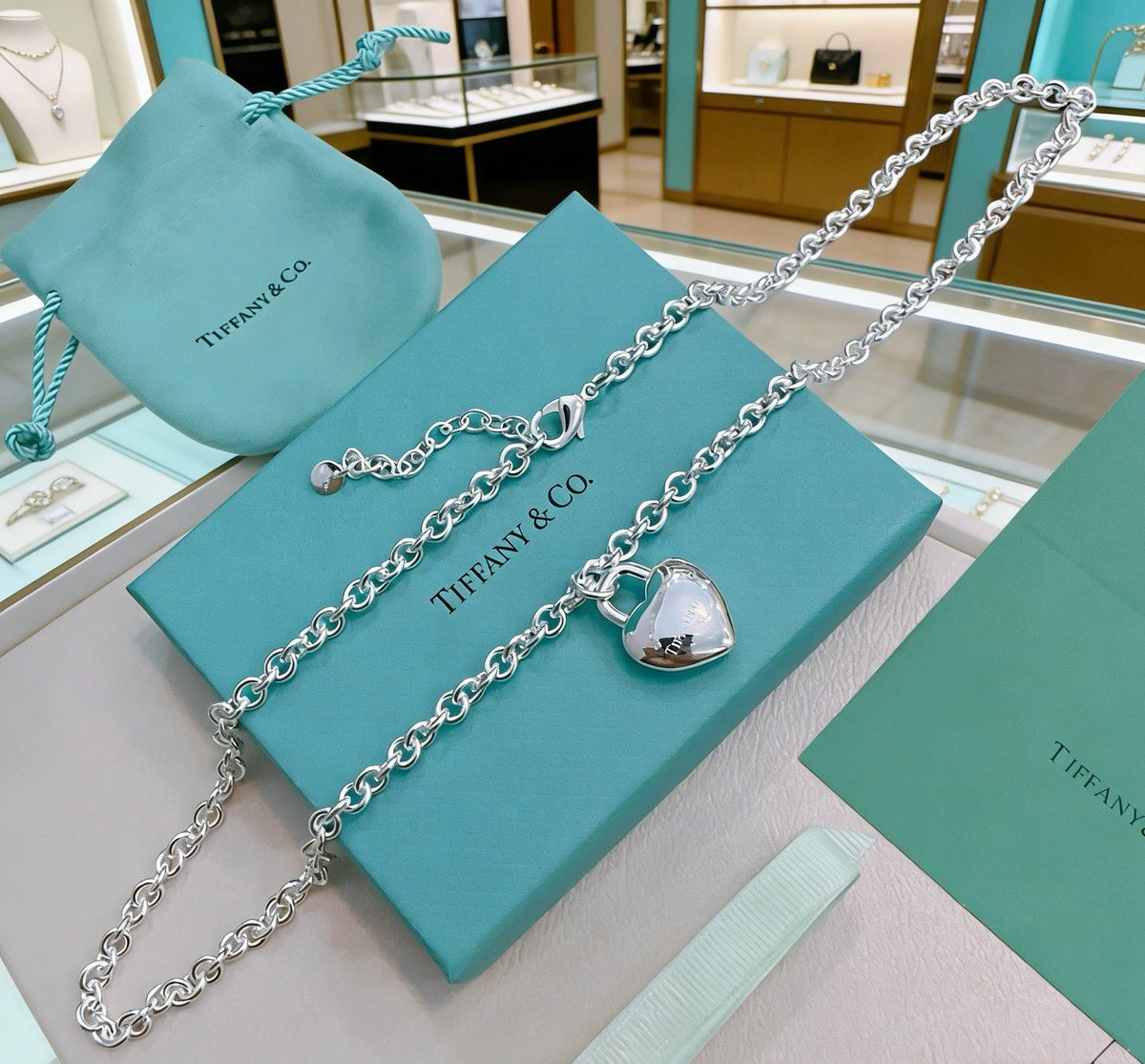 Martin Graham pendant necklace in polished metal-tone – side detail