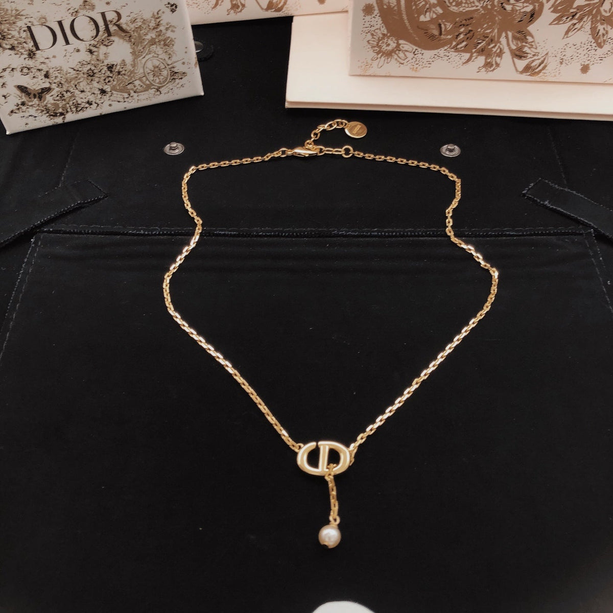 Martin Graham pendant necklace in polished metal-tone – side detail