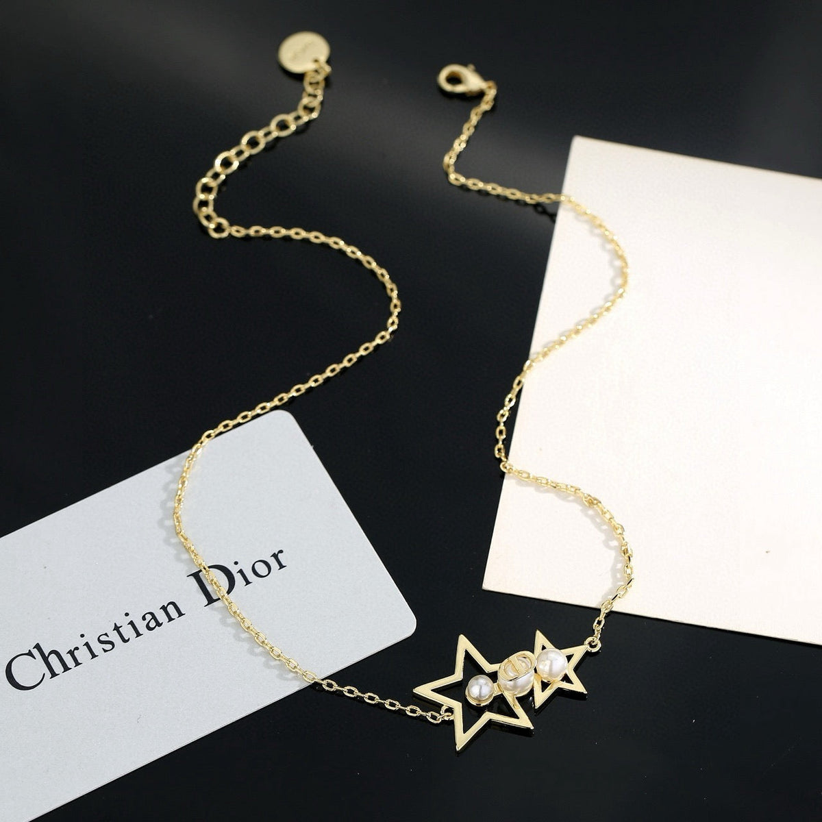 Martin Graham pendant necklace in polished metal-tone – side detail