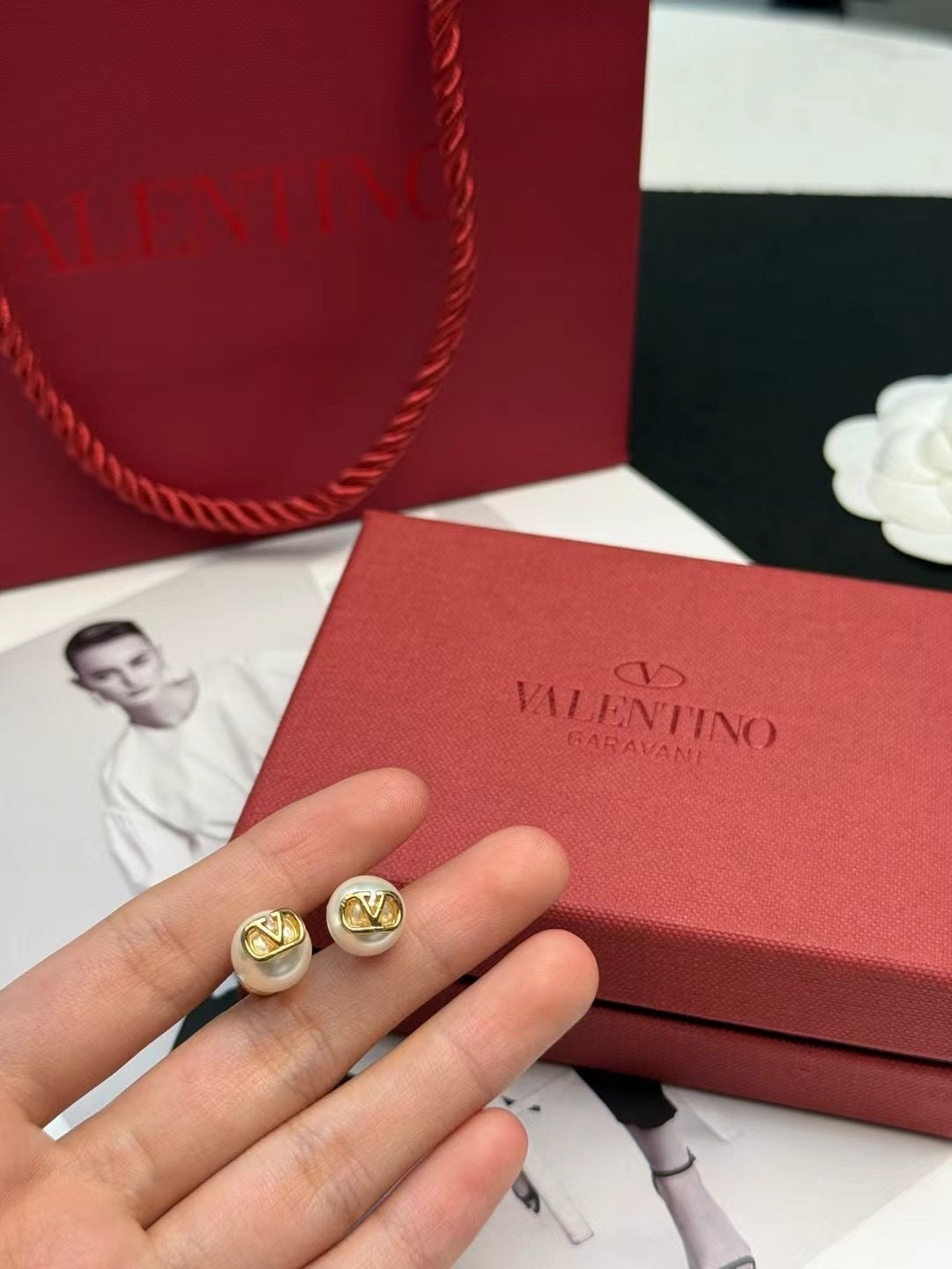 Martin Graham stud earrings in polished metal-tone – side detail
