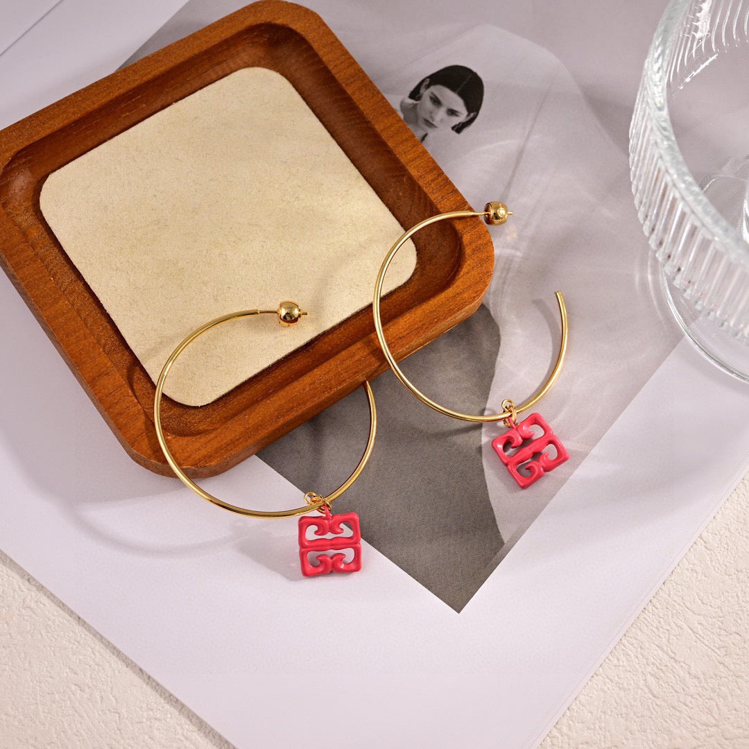 Martin Graham earrings in polished metal-tone