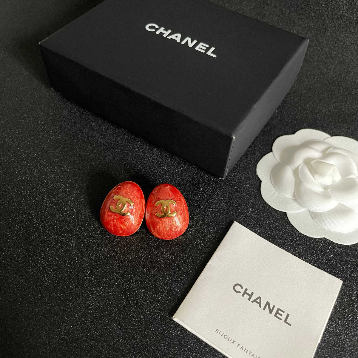 Martin Graham stud earrings in polished metal-tone – close-up detail