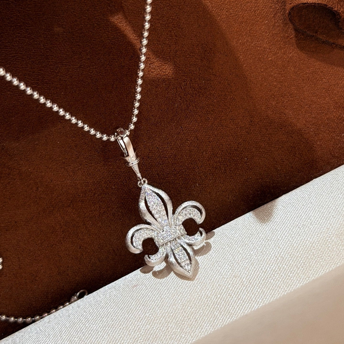 Martin Graham pendant necklace in polished metal-tone – close-up detail
