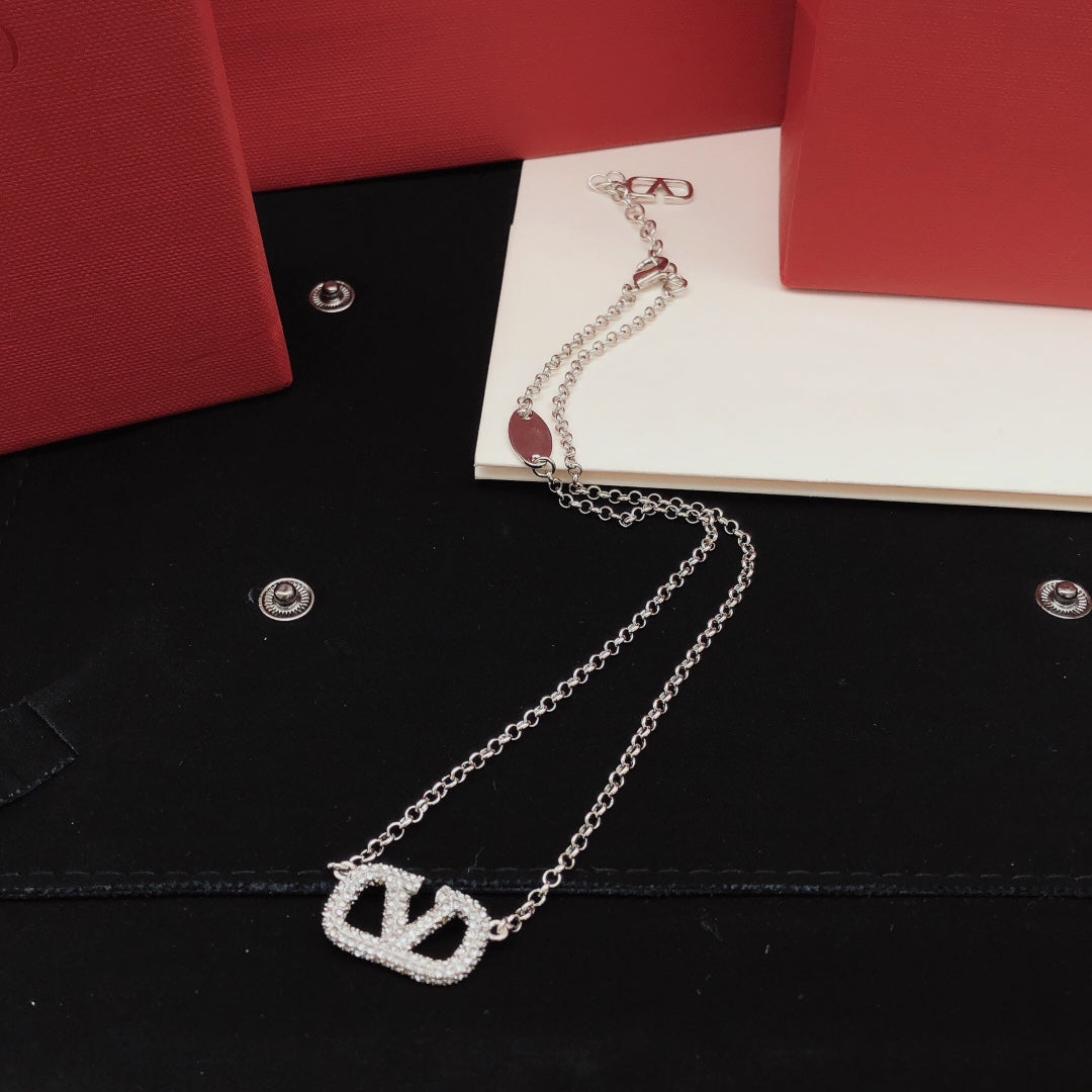 Martin Graham pendant necklace in polished metal-tone