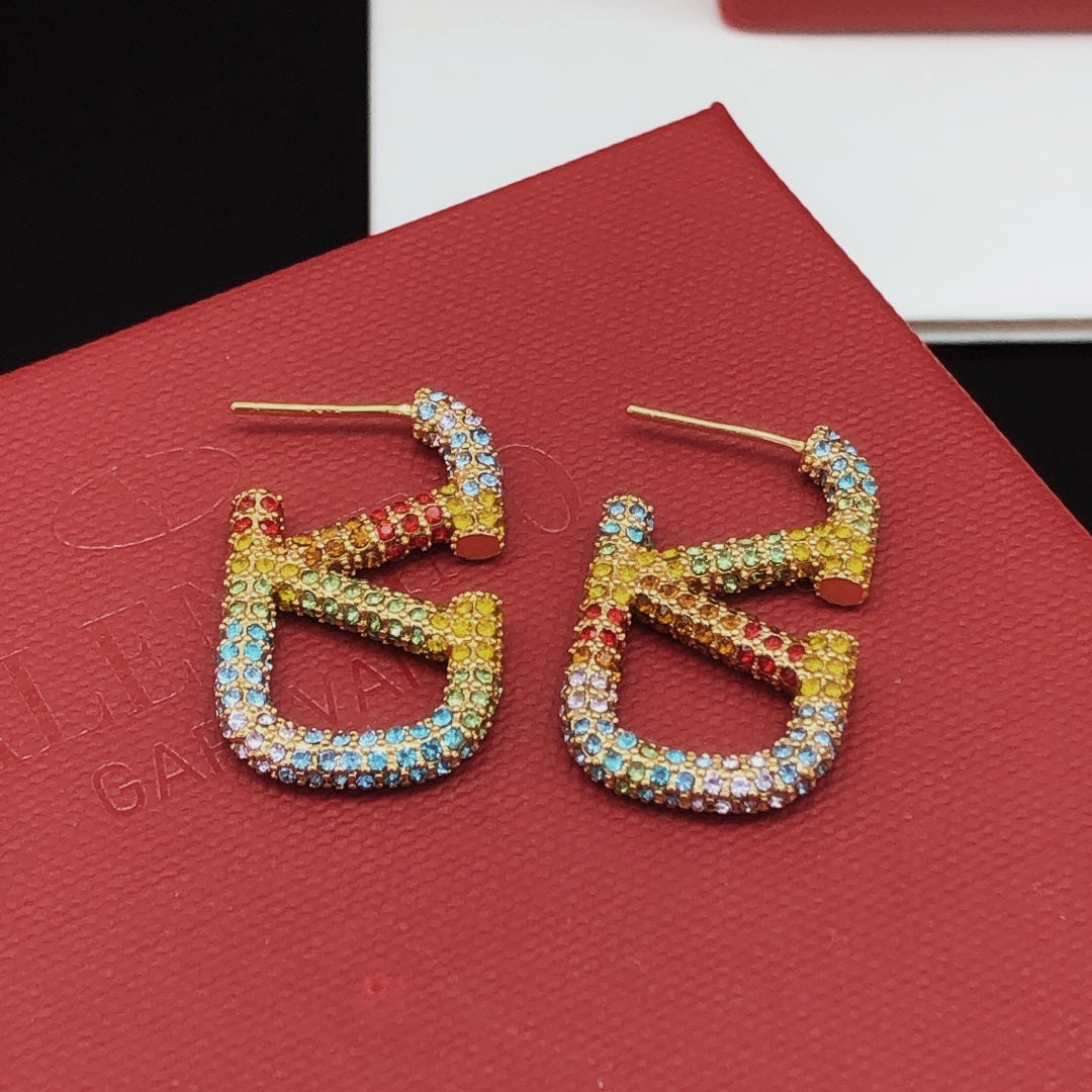 Martin Graham stud earrings in polished metal-tone
