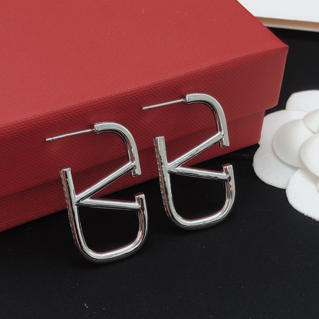 Martin Graham stud earrings in polished metal-tone
