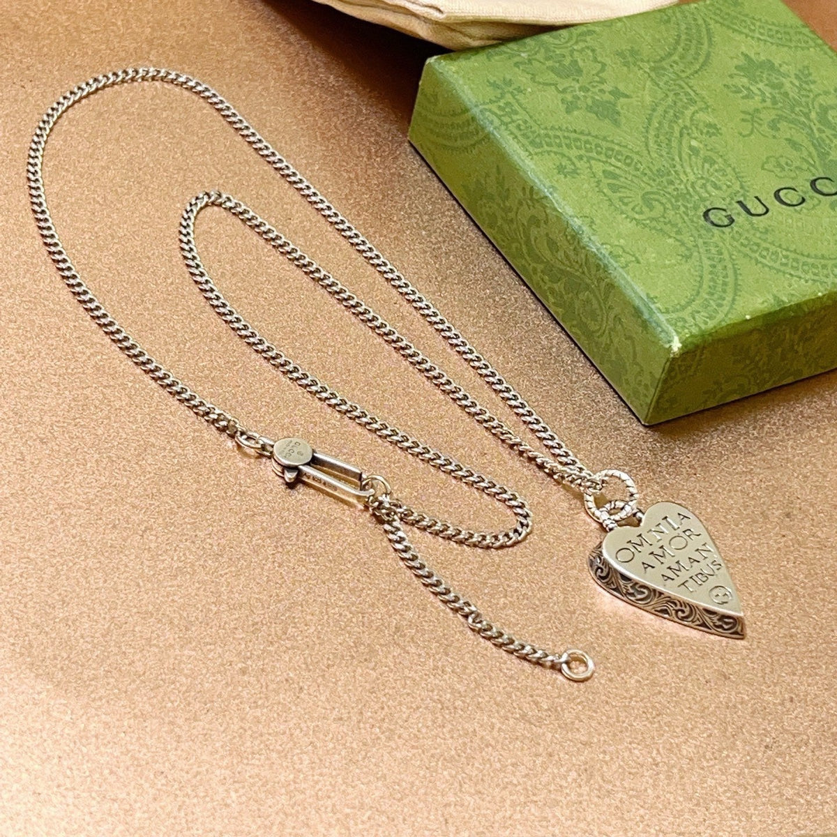 Martin Graham pendant necklace in polished metal-tone – close-up detail