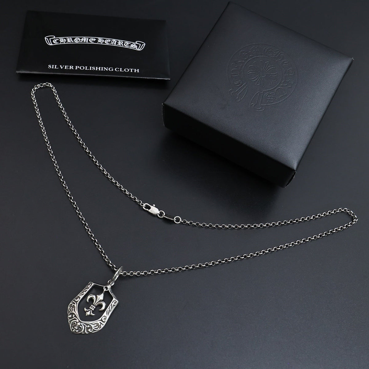 Martin Graham pendant necklace in polished metal-tone – close-up detail