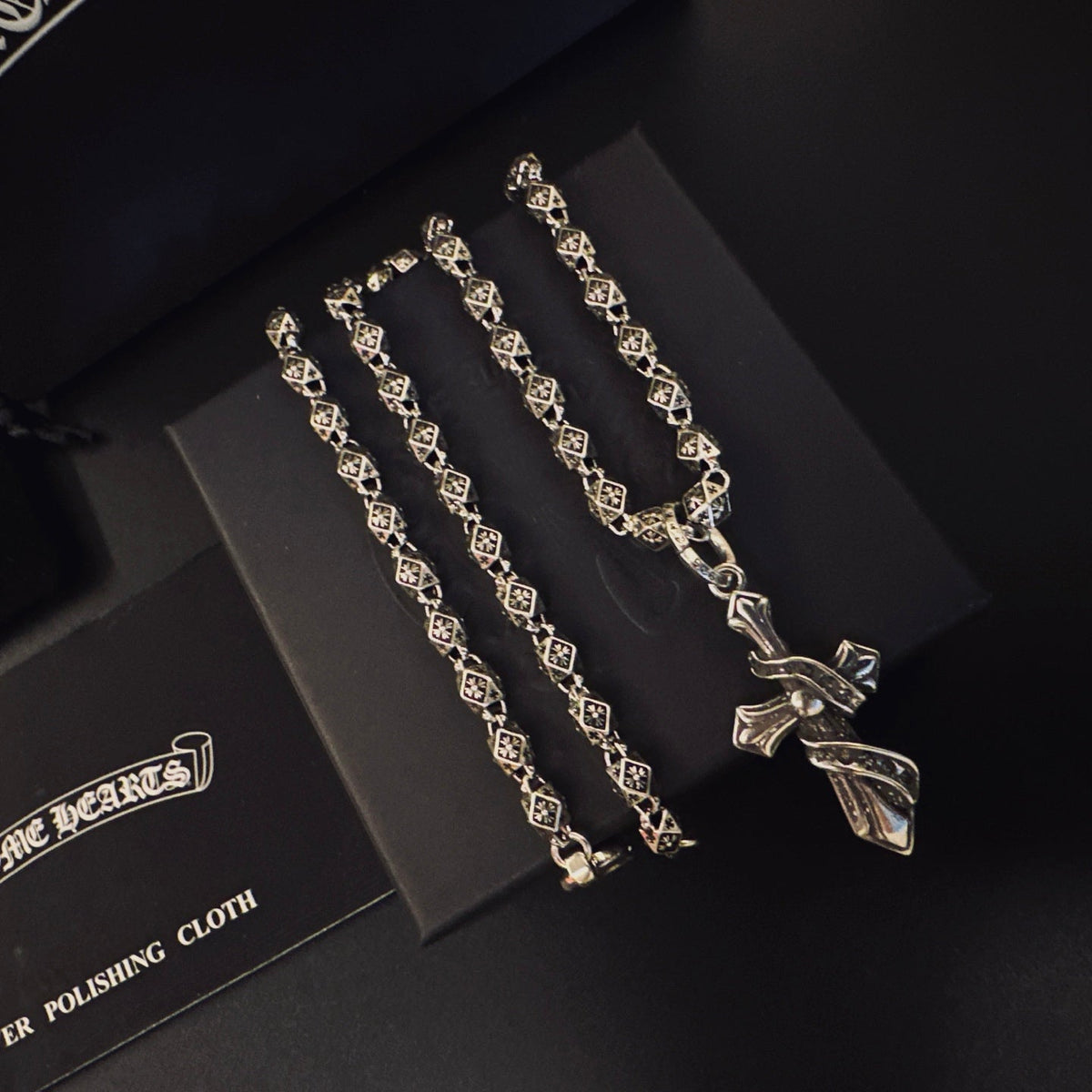 Martin Graham pendant necklace in polished metal-tone – close-up detail