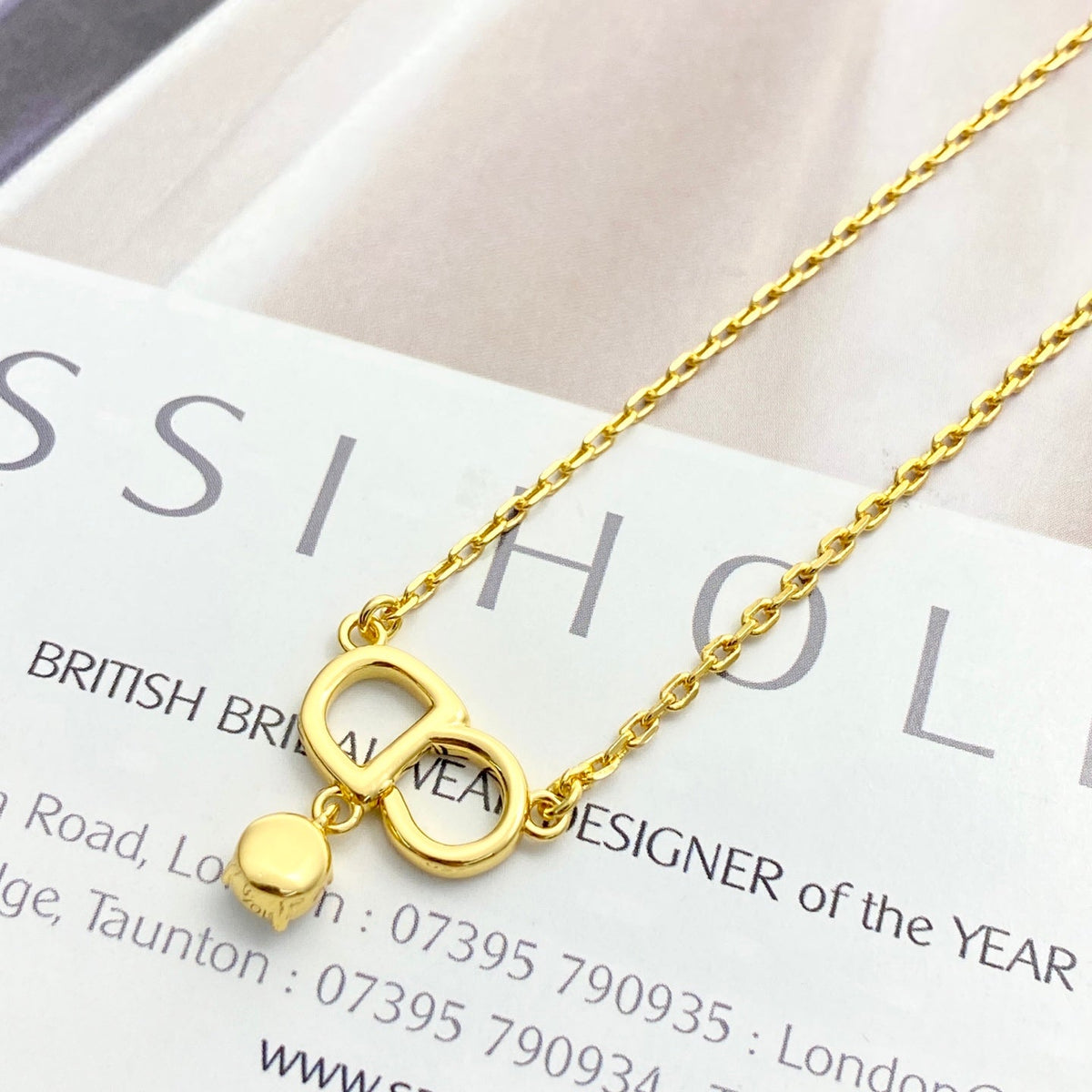 Martin Graham pendant necklace in polished metal-tone