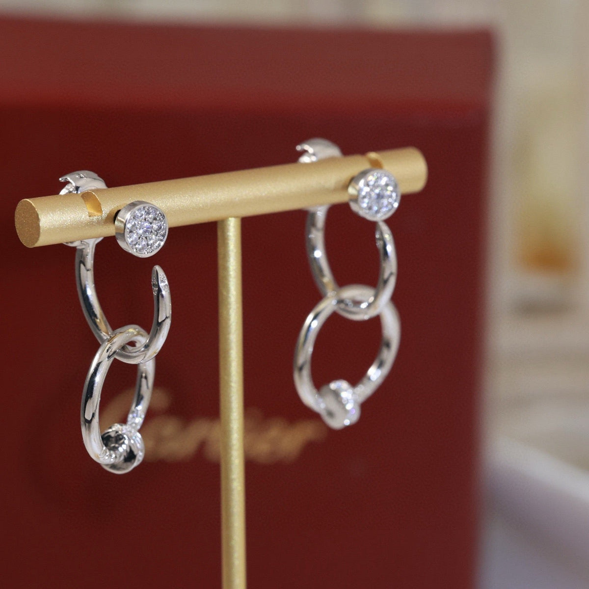 Martin Graham stud earrings in polished metal-tone