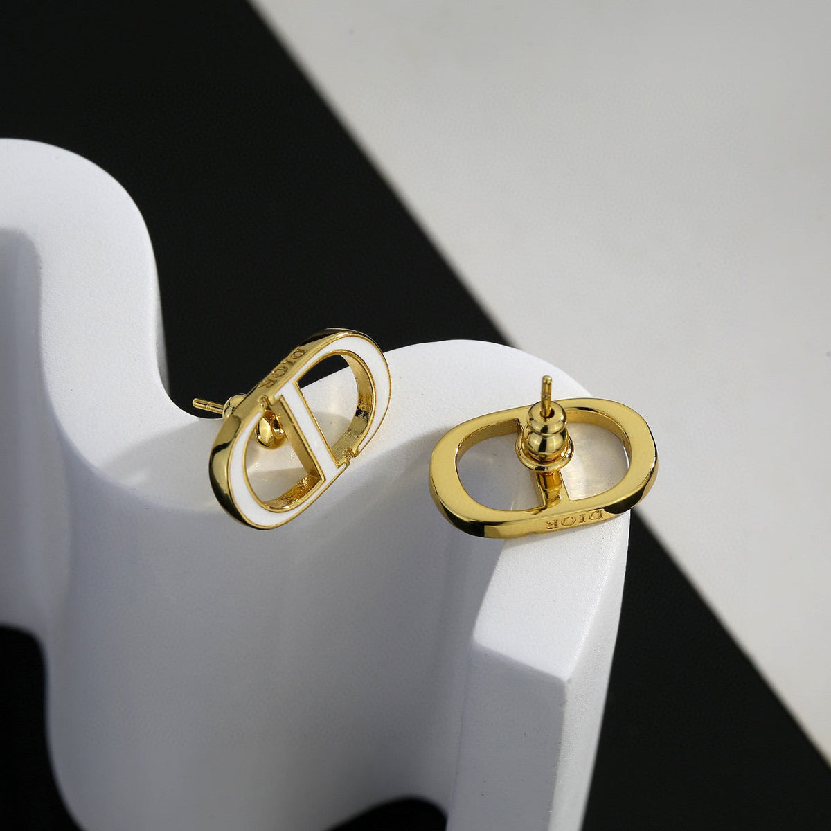 Martin Graham earrings in polished metal-tone