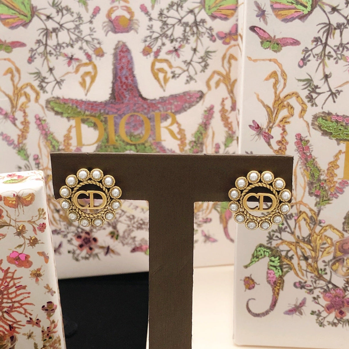 Martin Graham stud earrings in polished metal-tone