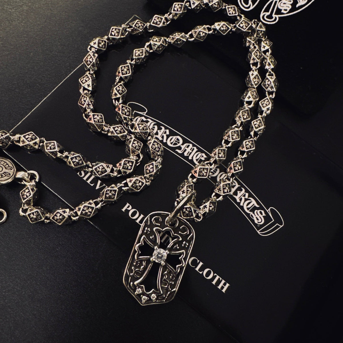 Martin Graham pendant necklace in polished metal-tone – close-up detail