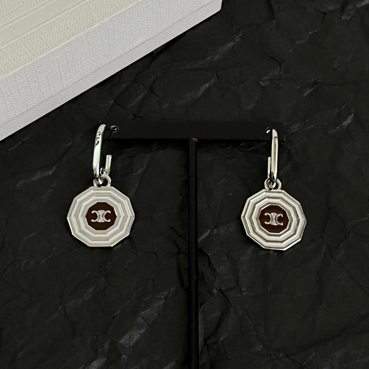 Martin Graham stud earrings in polished metal-tone