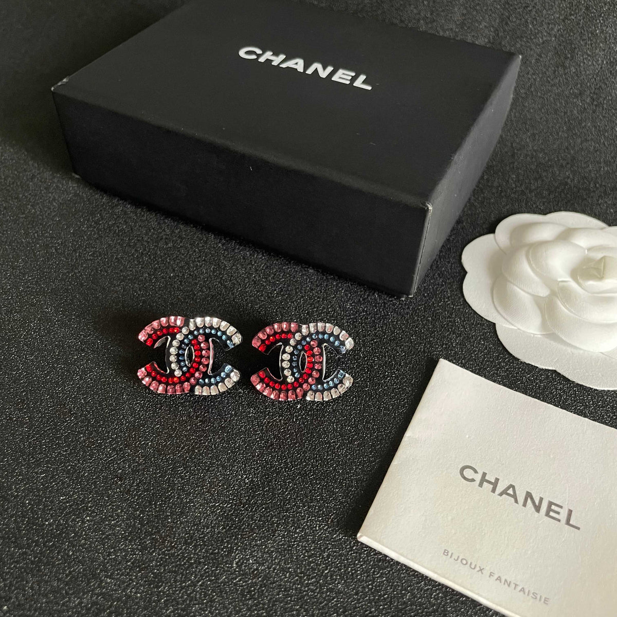 Martin Graham stud earrings in polished metal-tone – close-up detail