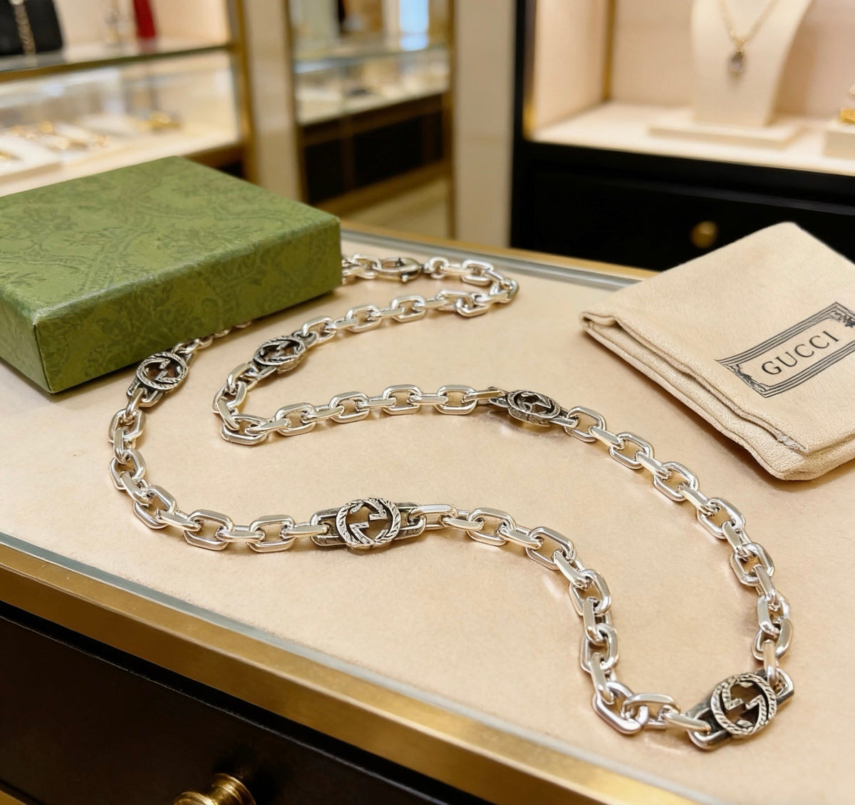 Martin Graham pendant necklace in polished metal-tone – close-up detail