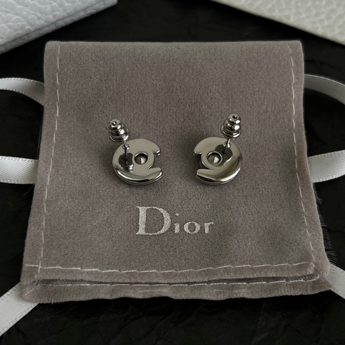 Martin Graham stud earrings in polished metal-tone