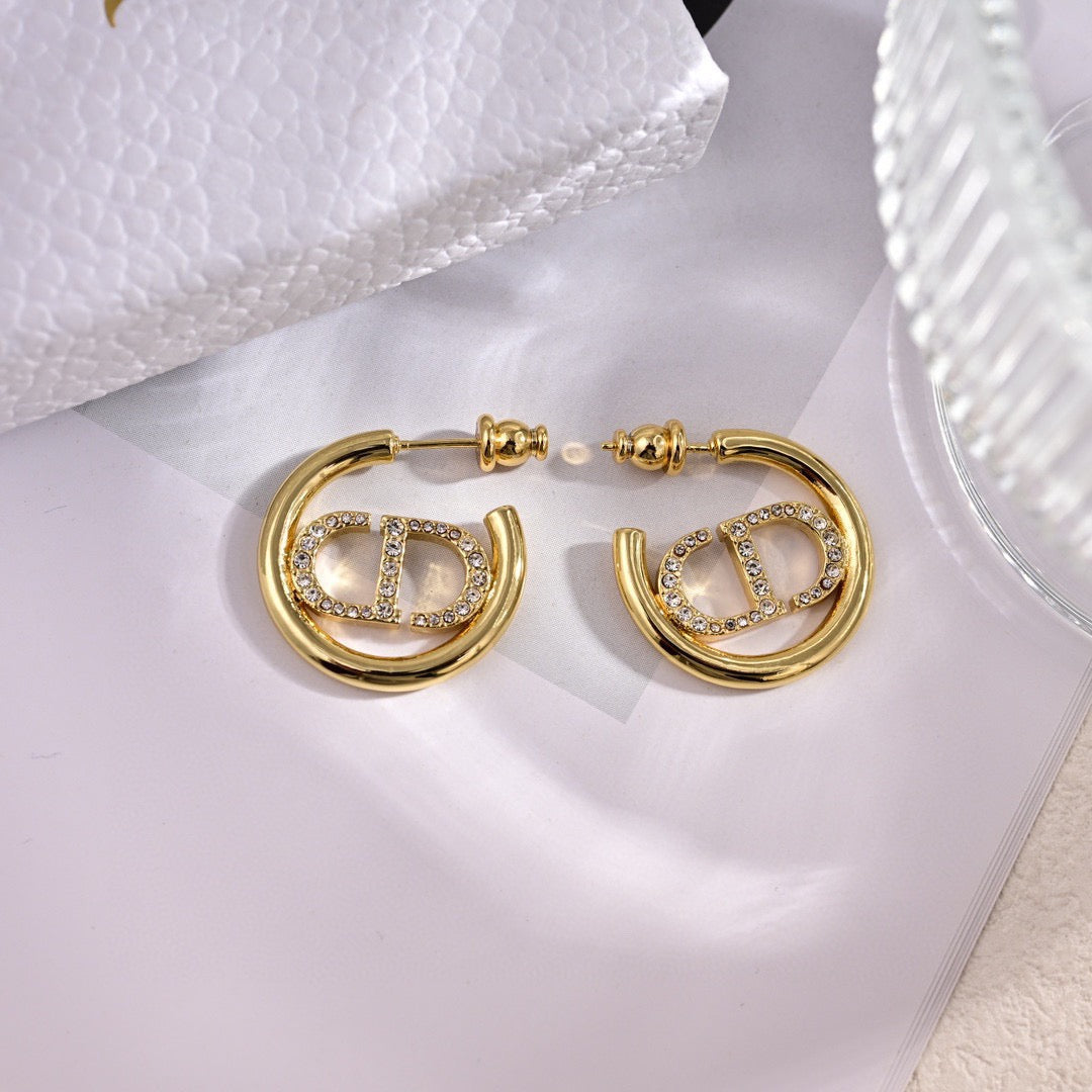 Martin Graham earrings in polished metal-tone