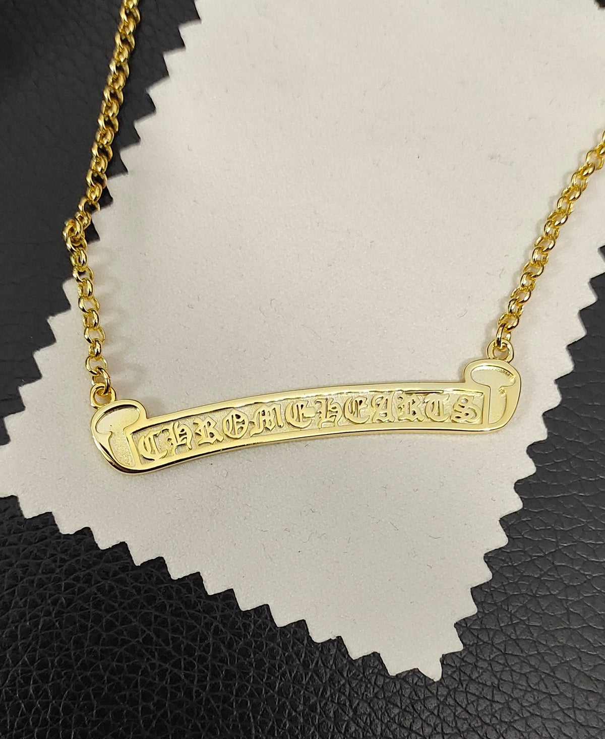 Martin Graham pendant necklace in polished metal-tone – close-up detail