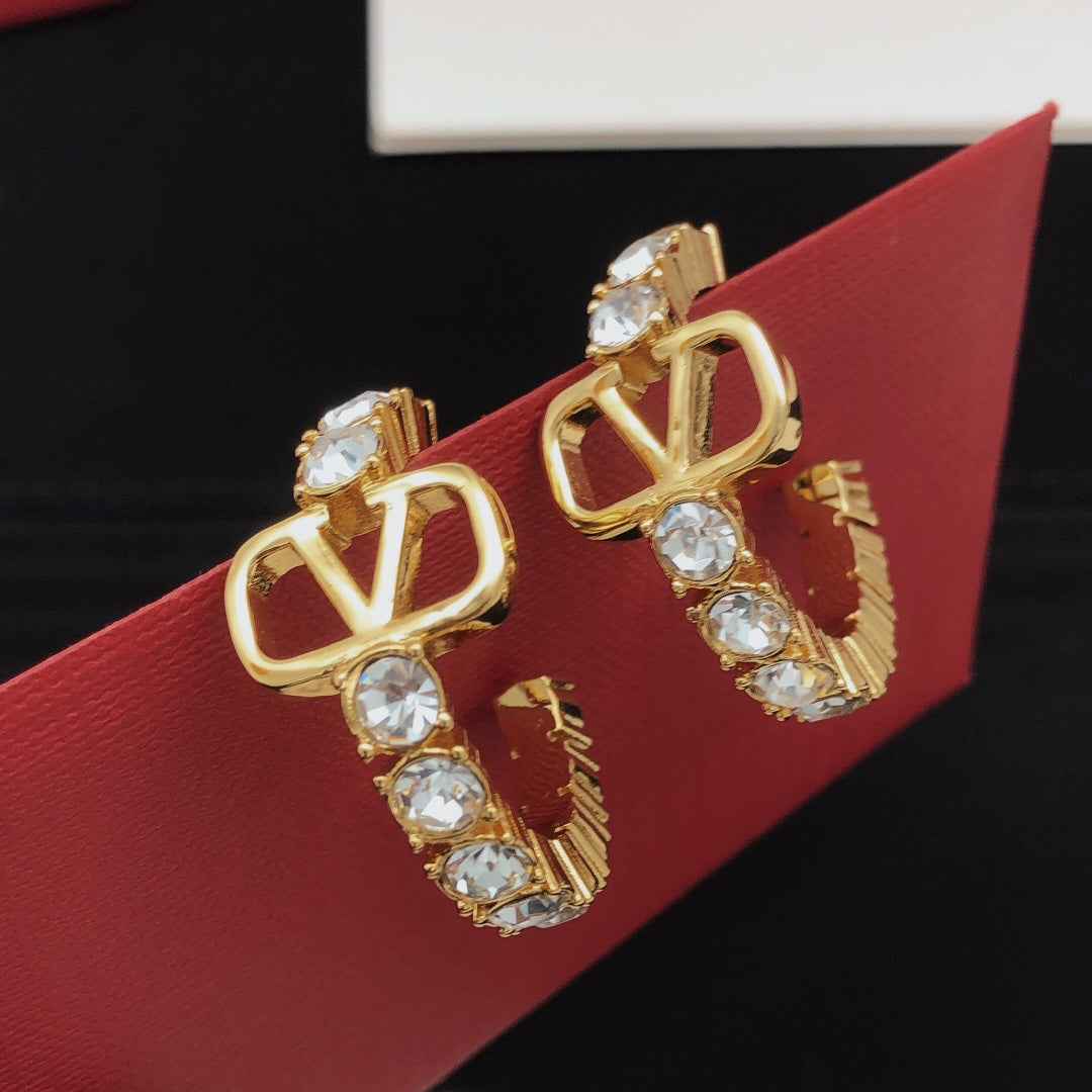 Martin Graham earrings in polished metal-tone