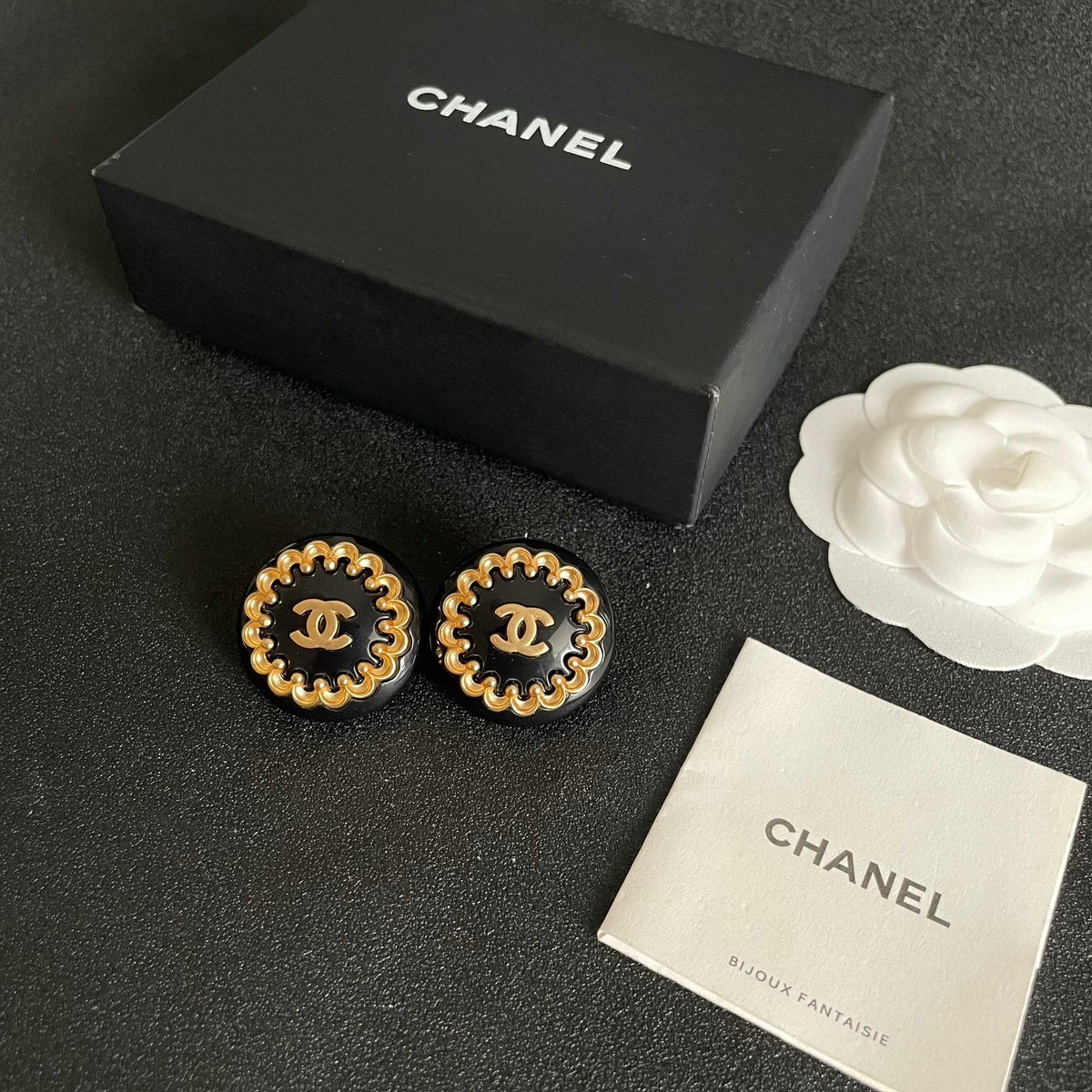 Martin Graham stud earrings in polished metal-tone – close-up detail