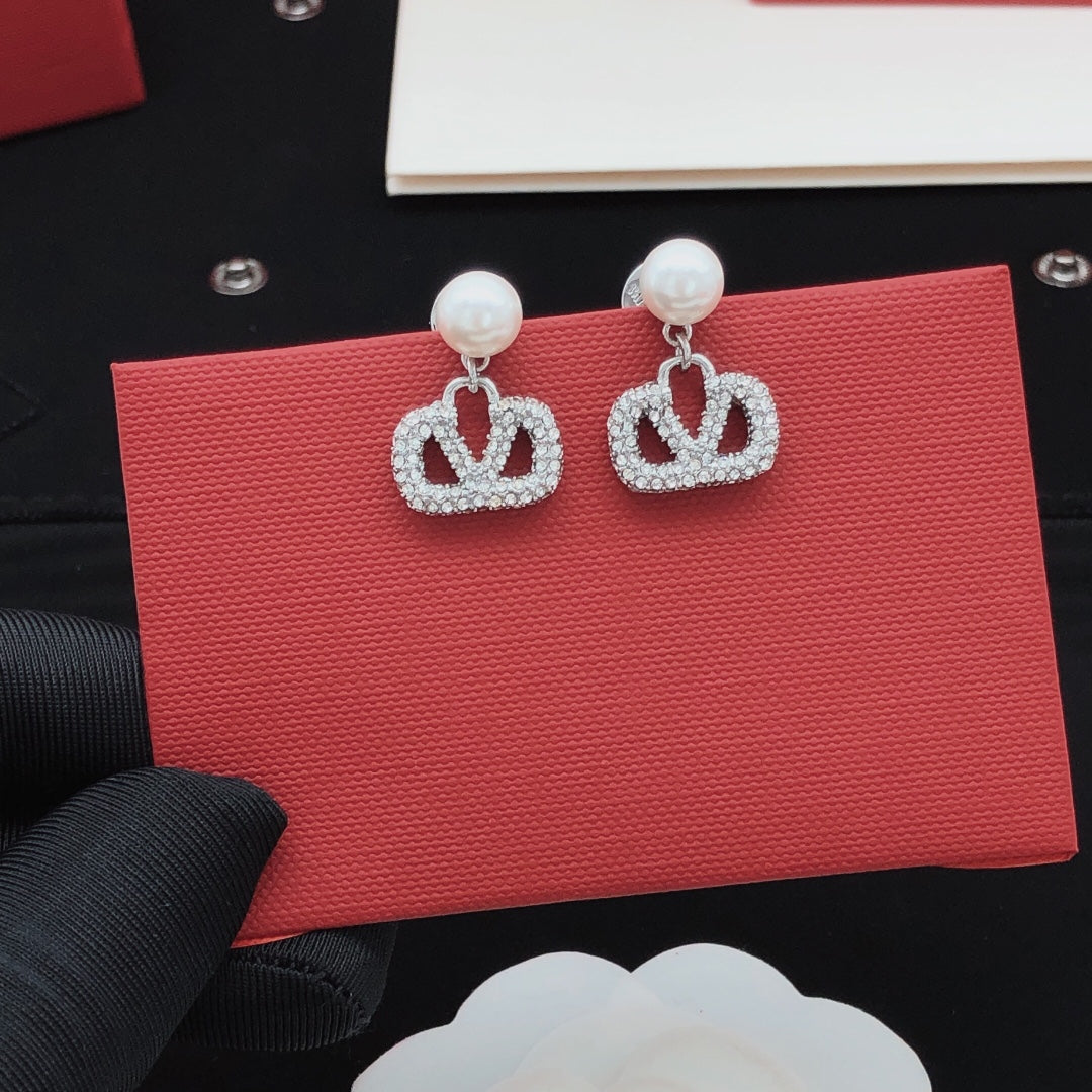 Martin Graham stud earrings in polished metal-tone