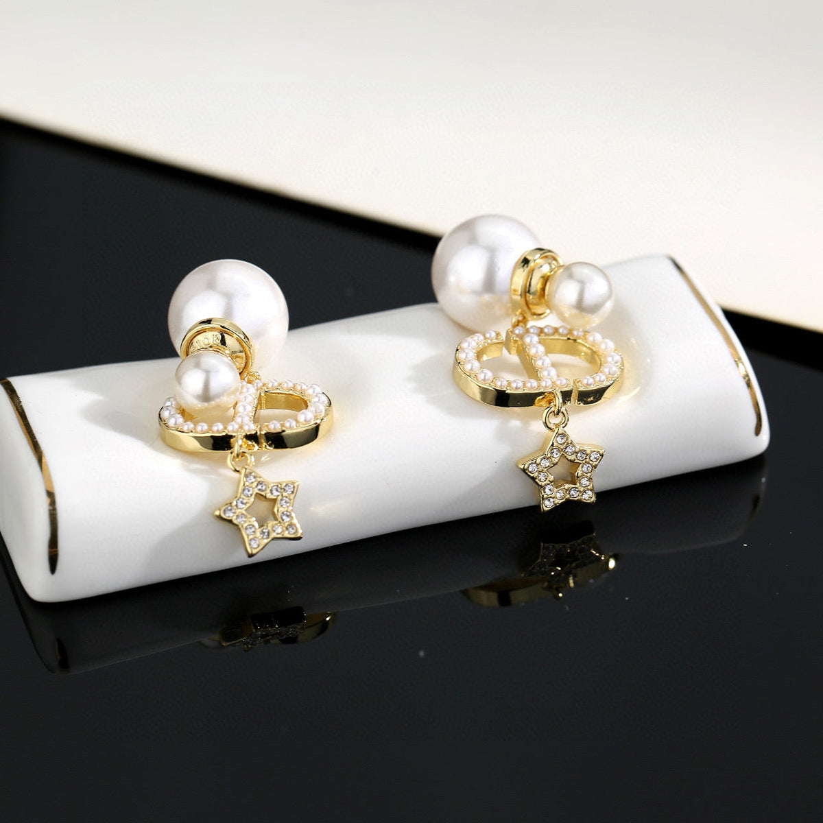 Martin Graham stud earrings in polished metal-tone