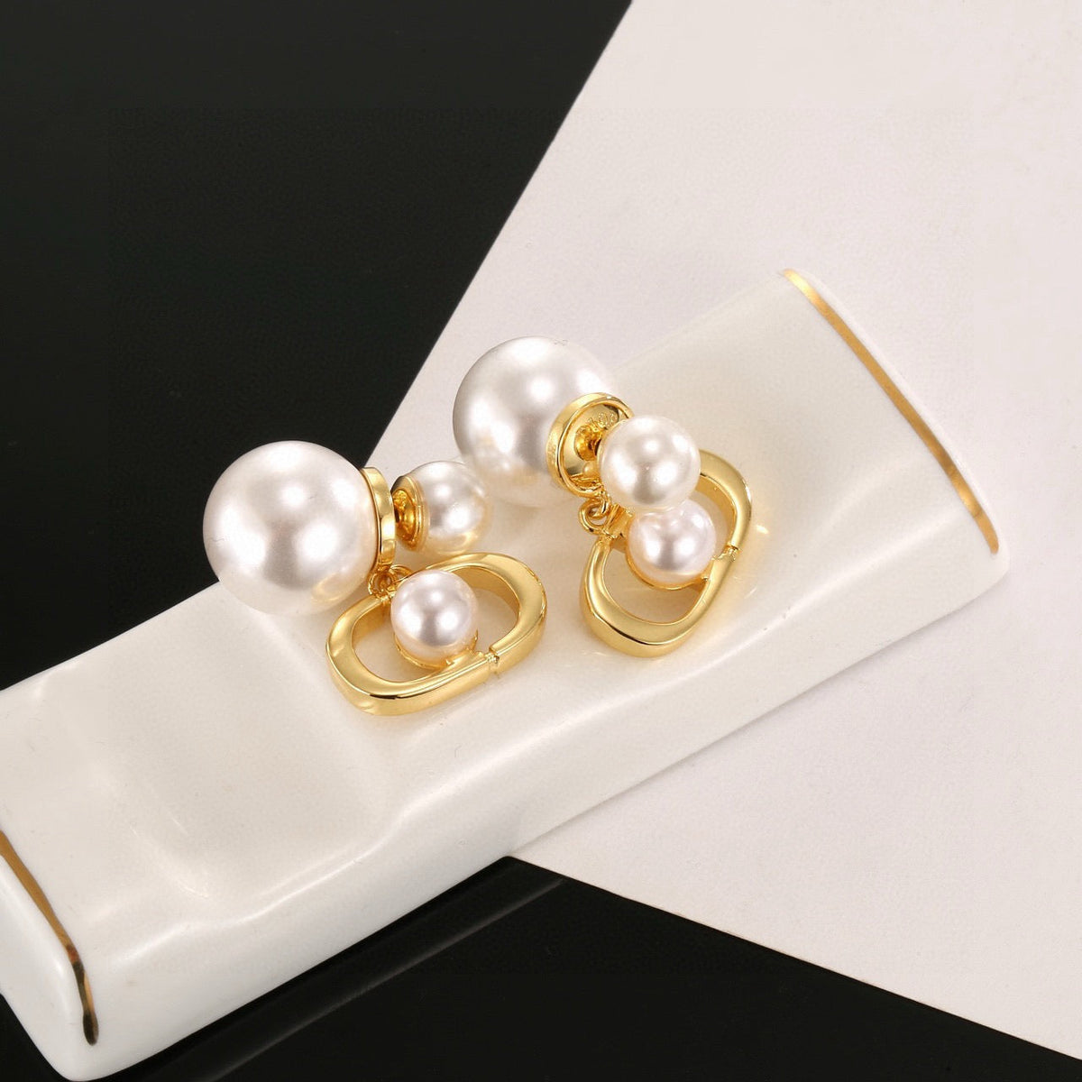 Martin Graham earrings in polished metal-tone