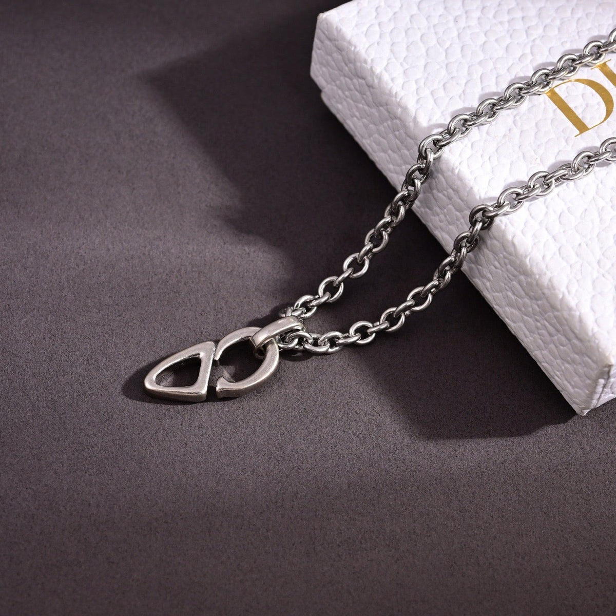 Martin Graham pendant necklace in polished metal-tone