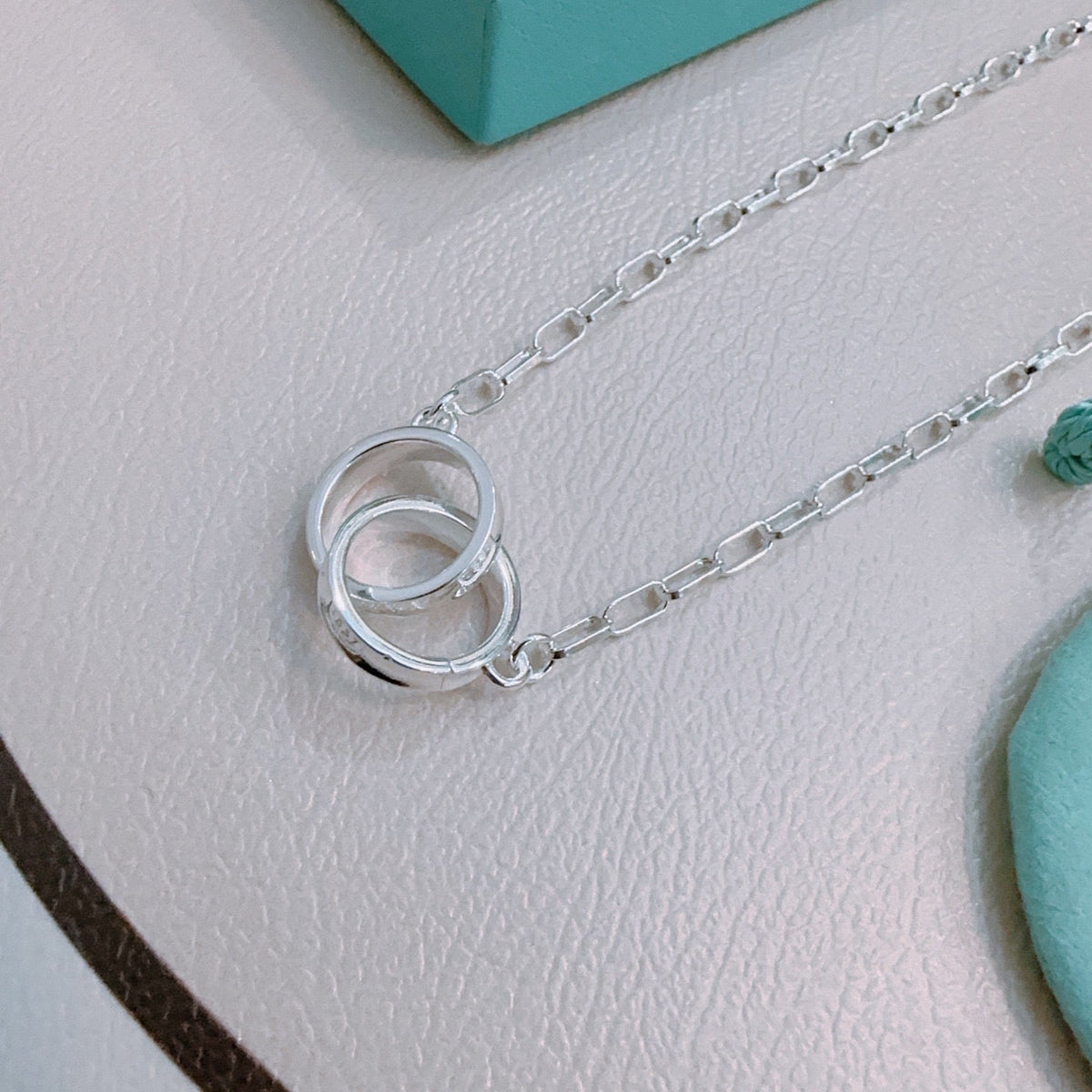 Martin Graham pendant necklace in polished metal-tone – close-up detail