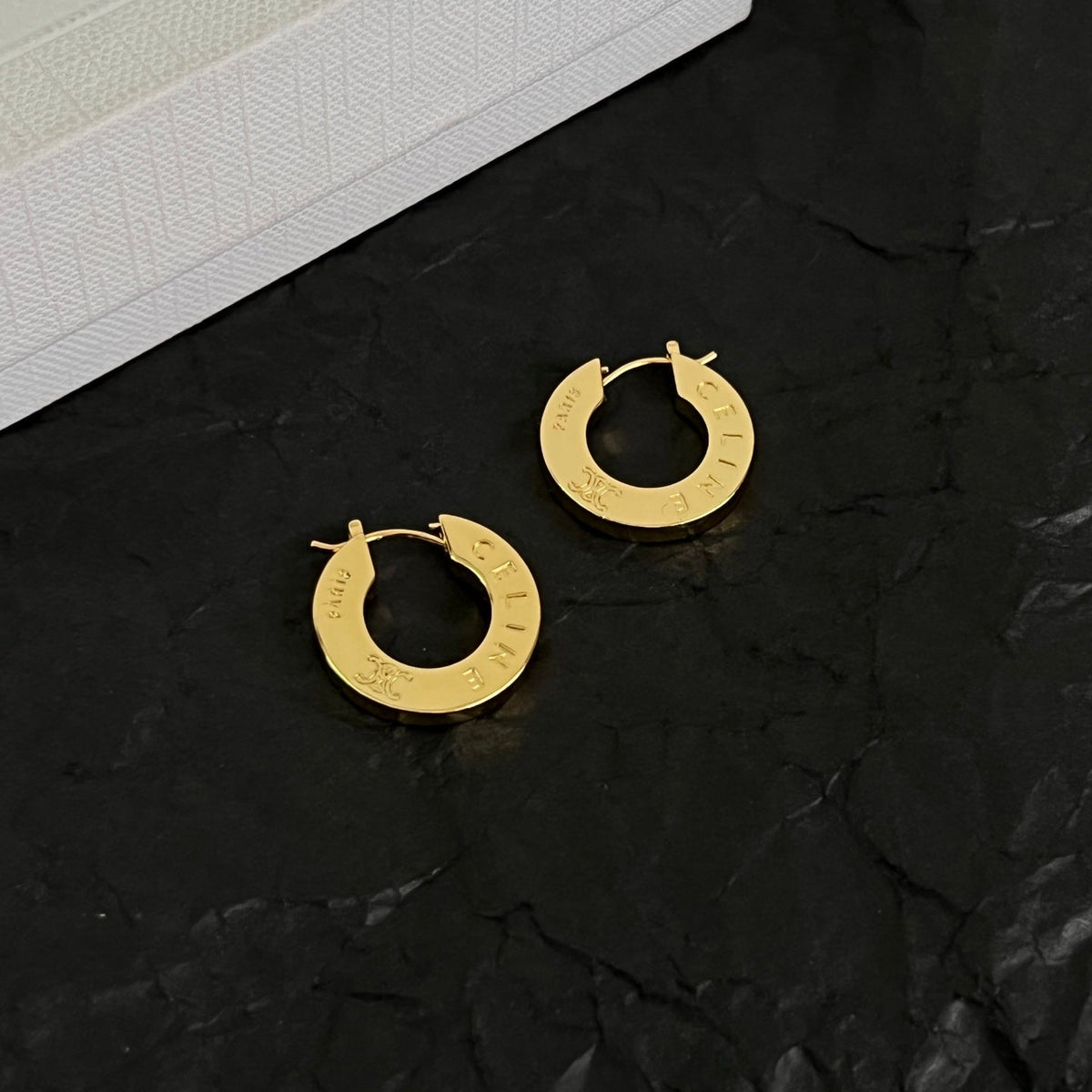 Martin Graham earrings in polished metal-tone