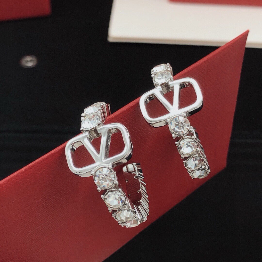 Martin Graham earrings in polished metal-tone