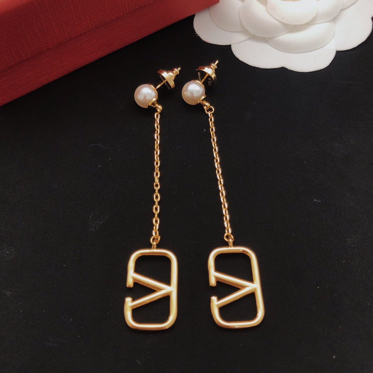 Martin Graham stud earrings in polished metal-tone